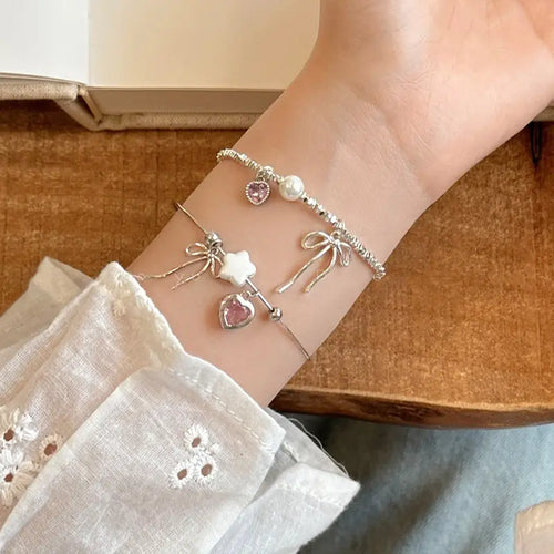 Broken Silver Bracelet with Love Bow & Pearl Accents