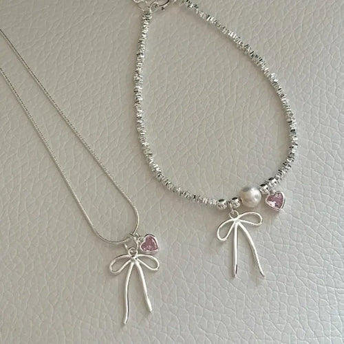 Broken Silver Bracelet with Love Bow & Pearl Accents